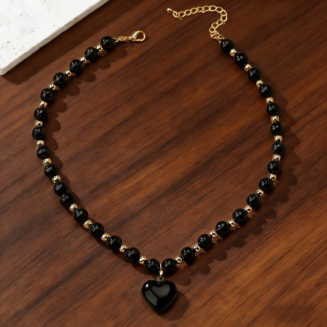 Collier obsidienne cœur noir et doré pour femme – Maison du Collier