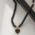 Collier perle noire pendentif cœur doré — ras de cou femme — Maison du Collier