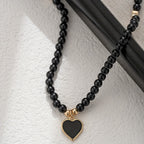 Collier perle noire pendentif cœur doré — ras de cou femme — Maison du Collier