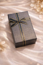 Écrin cadeau noir et or Maison du Collier — prêt à offrir