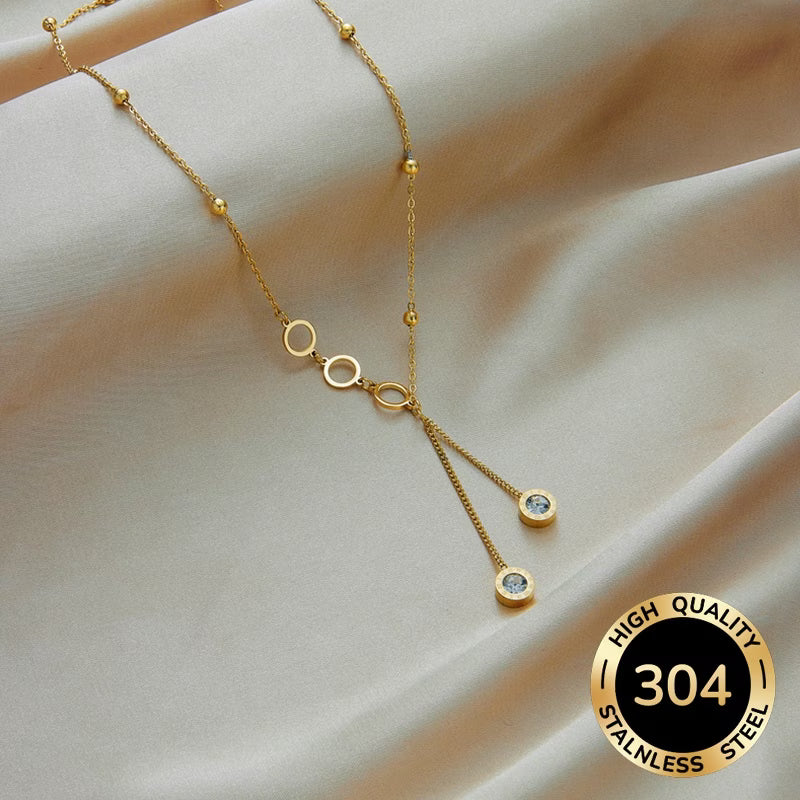 Collier en Y chiffres romains doré — dimensions 40 cm réglable 4 cm — acier inoxydable 304